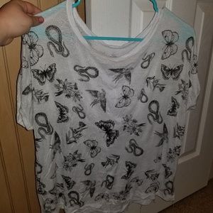 T shirt with animals and flowers on it